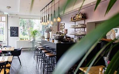 interior-shot-cafe-with-chairs-near-bar-with-wooden-tables